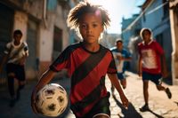 kinder-spielen-draussen-fussball