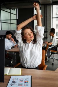 medium-shot-woman-stretching-work (2)