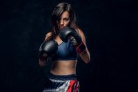 young-attractive-female-boxer-with-long-hair-boxing-gloves-is-ready-fight